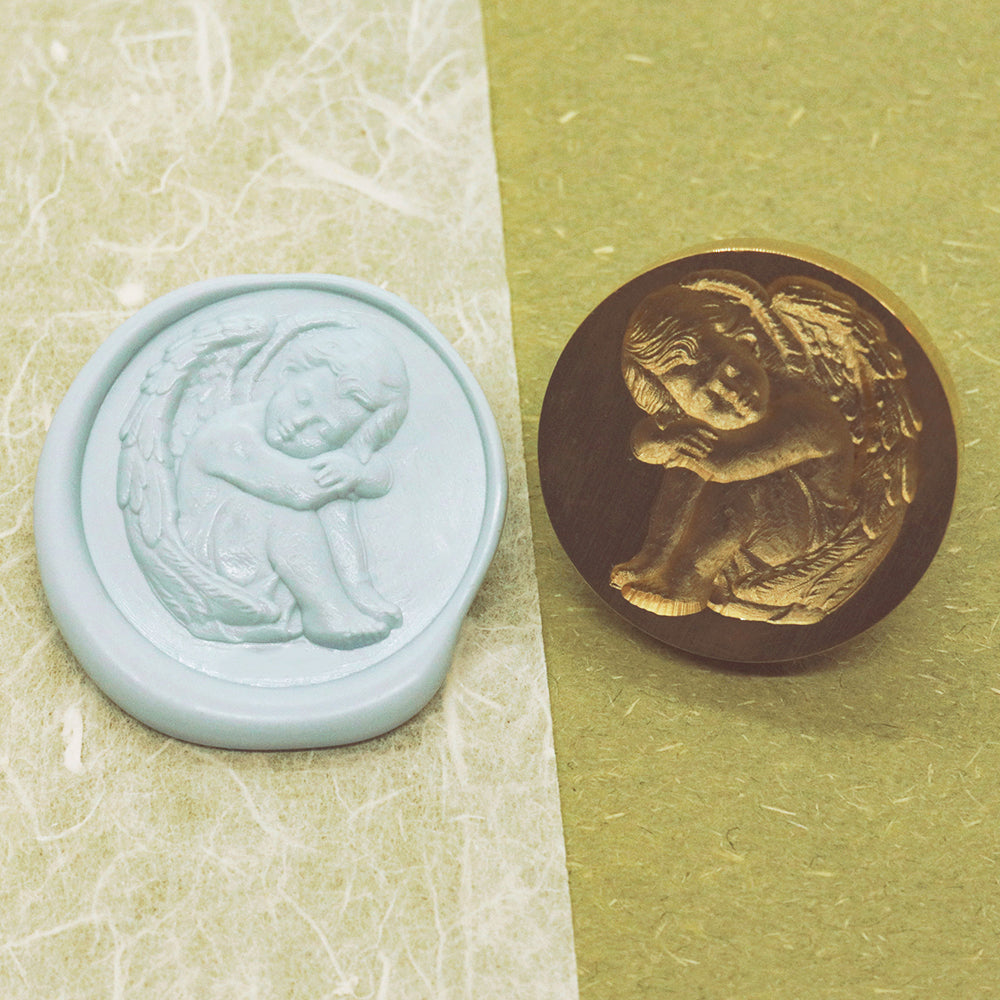 A 3D sleeping cherub wax seal stamp from AMZ Deco.